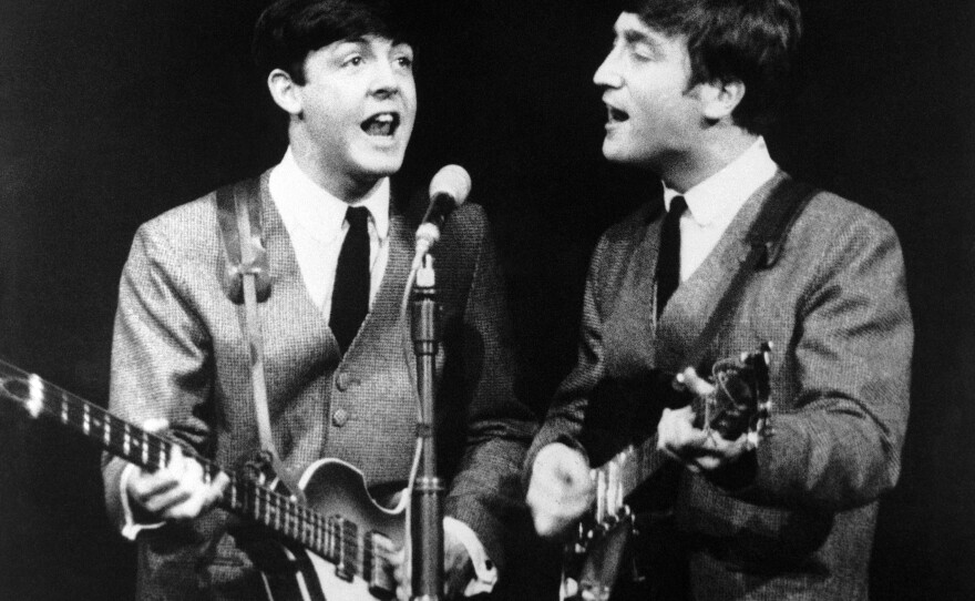 Paul McCartney and John Lennon during a concert in London on Nov. 11, 1963.