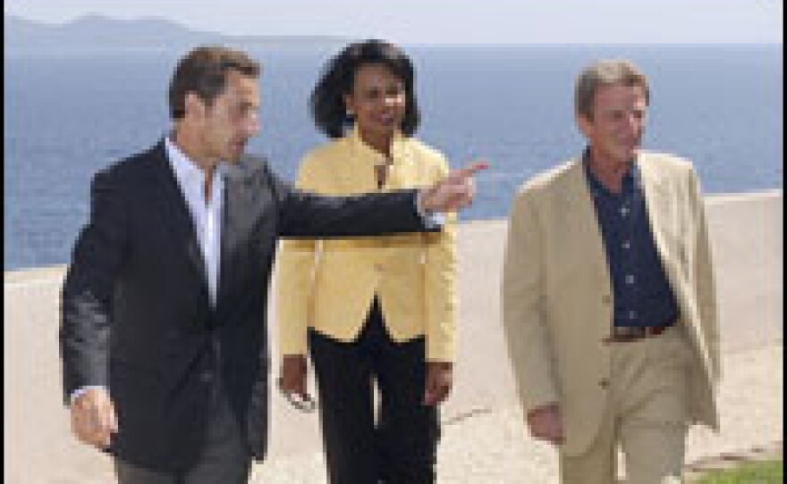 U.S. Secretary of State Condoleezza Rice met with France's President Nicolas Sarkozy (left) and Foreign Minister Bernard Kouchner (right) Thursday. Rice stopped in France to talk with foreign officials about a cease-fire agreement negotiated by Sarkozy on the Russian-Georgian conflict. She heads to Georgia Friday.