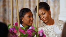 First lady Michelle Obama explains the history and protocol surrounding official state dinners with a group of young women from the White House Leadership and Mentoring Program on Tuesday.