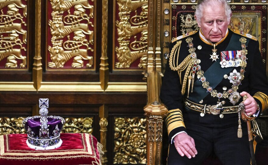 Britain's Prince Charles sits by the Imperial State Crown in the House of Lords on Tuesday during the opening of Parliament in London.
