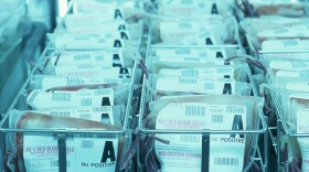 Promotional photo of packages of blood in a blood bank. 