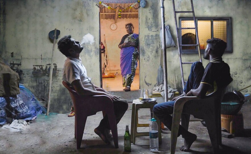 Ganesh and Rakesh in conversation as Kaki looks on