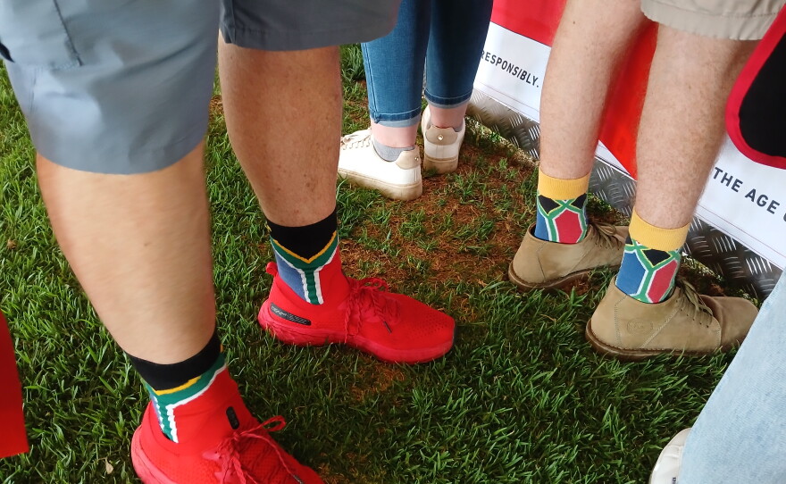 Participants at a braai challenge in Pretoria wear matching South African flag socks.
