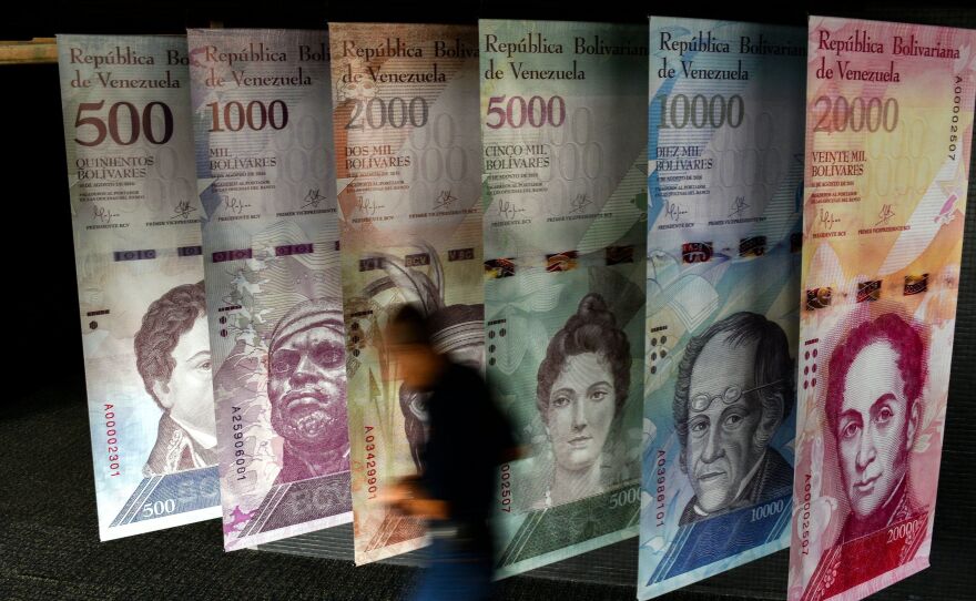 A banner depicting Venezuela's currency, the bolivar, at the central bank of Venezuela in Caracas in January. The bolivar has lost the vast majority of its value in just the last year.