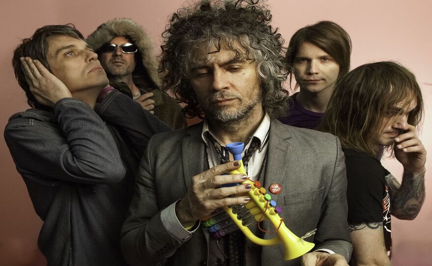 Wayne Coyne (center) with the rest of The Flaming Lips.