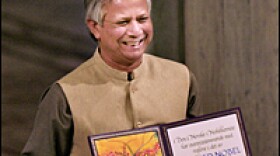 Nobel Peace laureate Muhammad Yunus holds the Nobel medal and diploma at Oslo Town Hall Dec. 10, 2006. The micro-credit pioneer from Bangladesh won the Nobel Peace prize for his work to end poverty.