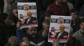 The members of Arab-Turkish Media Association and friends hold posters as they attend funeral prayers in absentia for Saudi writer Jamal Khashoggi who was killed last month in the Saudi Arabia consulate, in Istanbul, Nov. 16, 2018.