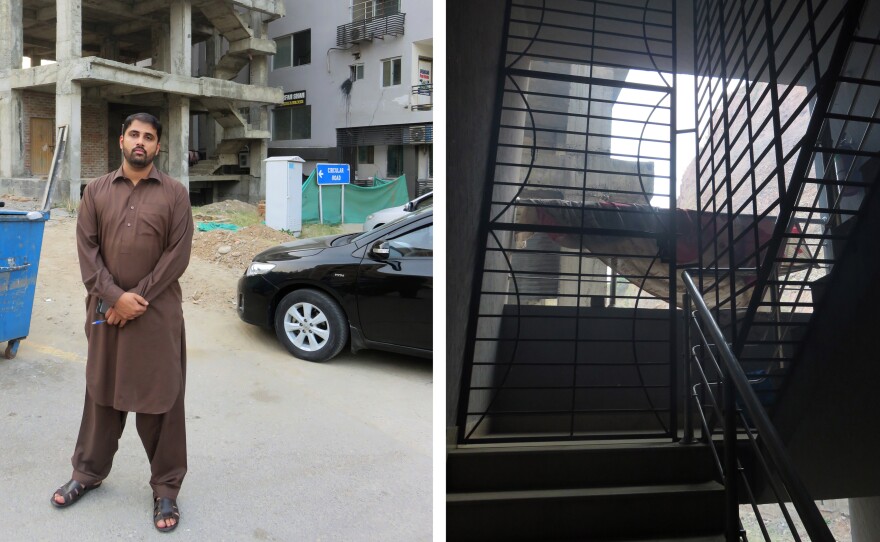 Police detective Aizaz Azam (left) stands outside the apartment block where 24 impoverished Pakistanis were imprisoned by a kidney trafficking gang. Barred windows on stairs leading to the apartment kept prisoners from escaping.