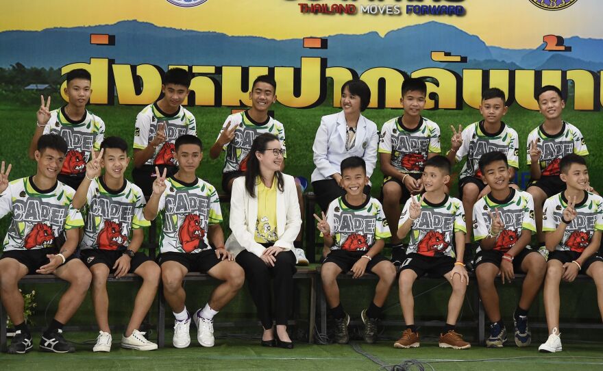 Twelve boys and their soccer coach, rescued from a flooded cave in northern Thailand, described their ordeal at a news conference in Chiang Rai on Wednesday, after they left the hospital.