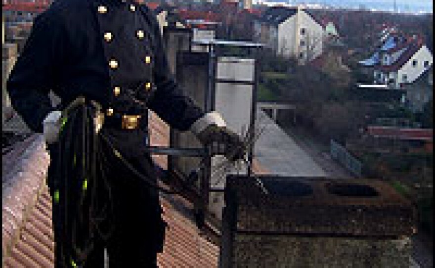 Tom Drust is a third generation chimney sweep in Erfurt, Germany.  Here he is cleaning a chimney on an apartment building where the residents still use only wood or coal for heating.