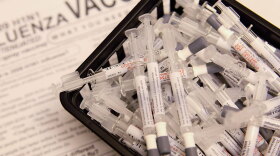 Doses of H1N1 influenza vaccine sit in a basket at Rush University Medical Center October 6, 2009 in Chicago, Illinois.
