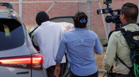 Immigration and Customs Enforcement officer Christian Castro gets into a car surrounded by news reporters moments after being released from the Carrizalez-Rucker Cameron County Detention Center in Brownsville, Texas on Aug. 27, 2026.