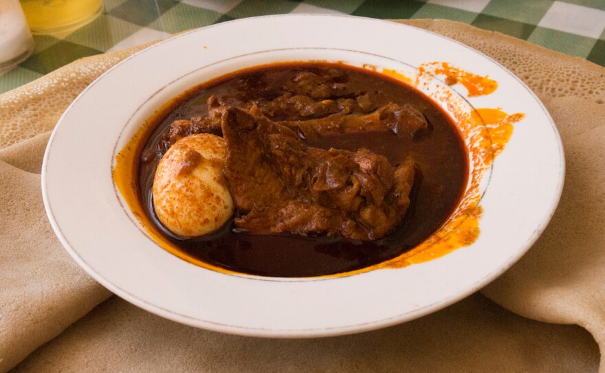 Doro wat, the traditional dish eaten in Ethiopia on Christmas Day, served with injera bread.