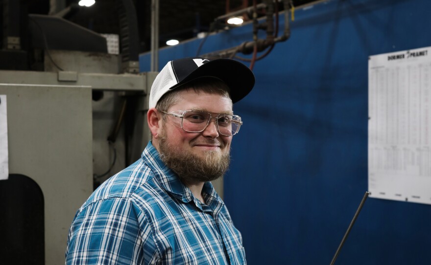 Moss stands at his post in Virco's tool and die area.