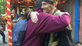 Johnny Fox hugs a fan at the Maryland Renaissance Festival. This fall, Fox has made a triumphant comeback even as he battles with health issues.