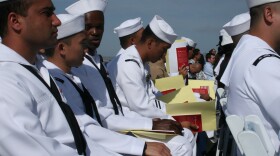Sailors and Marines take the oath of U.S. citizenship on the USS Midway on May 13, 2010.