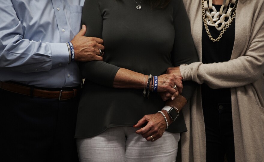 Neysa Tonks' parents, Chris and Debbie Davis, and sister, Mynda Smith, embrace during a news conference for Children of the 58 on Sept. 14, 2018,<strong> </strong>at the College of Southern Nevada in Las Vegas. Tonks was a single mother of three sons.