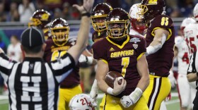 Central Michigan quarterback Tommy Lazzaro (7) reacts after scoring a touchdown during the second half of the Mid-American Conference championship NCAA college football game against Miami of Ohio, Saturday, Dec. 7, 2019. 