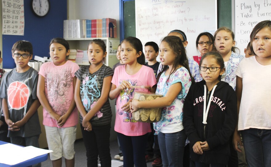 Navajo students at Crystal Boarding School in New Mexico sing traditional songs in class.