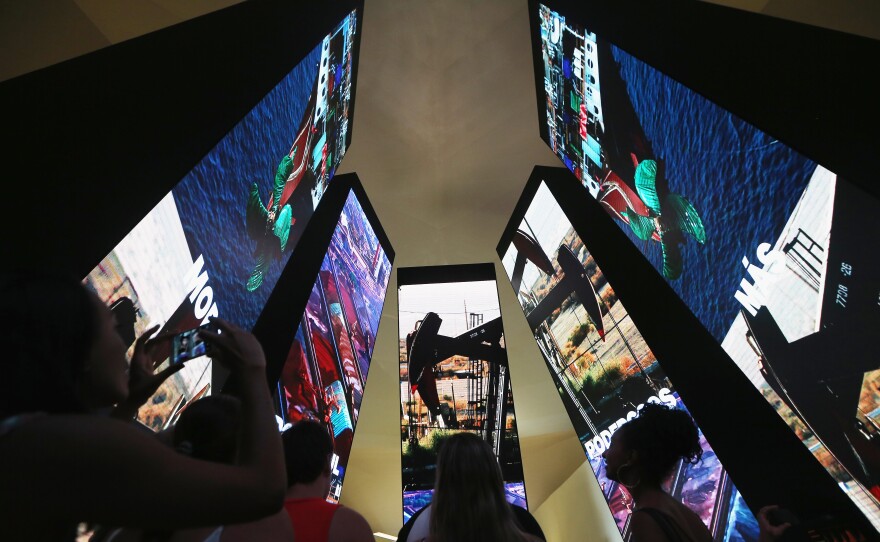 The museum features 'totems' that represent the various ways in which humans have shaped their environment.