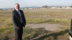 Peter Drinkwater, the director of airports for San Diego County, stands by the 70 blank acres that will be redeveloped to expand Gillespie Field. 