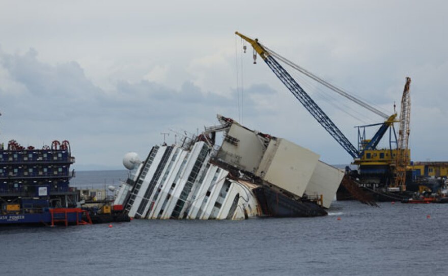 Bow of the Costa Concordia wreck. Salvage crews attach large air tanks, called sponsons, to the port side that will provide buoyancy when the ship is towed away from the island.