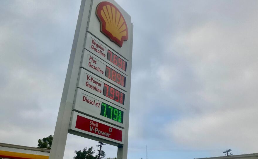 Gas prices at $7.69 for regular at a Shell station are shown.