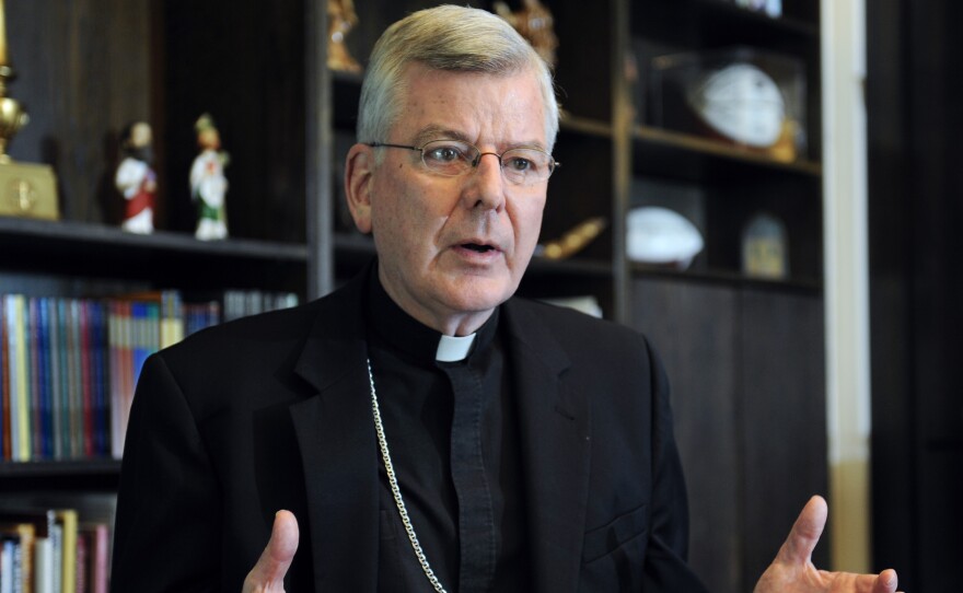 St. Paul-Minneapolis Archbishop John Nienstedt speaks at his office in St. Paul, Minn., in a photo taken in July. Nienstedt announced Friday that the archdiocese was filing for bankruptcy in the wake of more than a dozen claims from alleged sexual abuse victims.