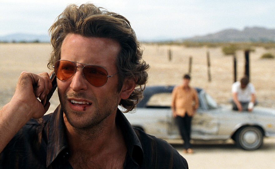 Bradley Cooper making the call in "The Hangover"