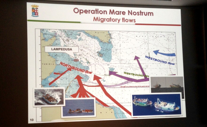 A slide of migratory flows in the Mediterranean Sea from the Mare Nostrum operation is displayed in the control room of the Italian operation, which tracks and intercepts migrant ships en route to Europe.
