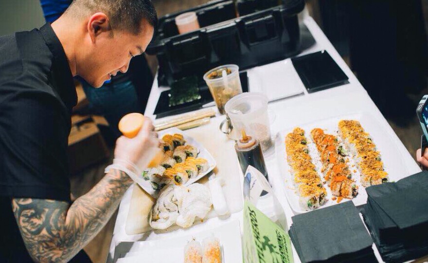 Austin sushi entrepreneur Peter Yung makes an Insectopia Roll at the Future Food Salon in Austin, Texas, in February 2014. A British researcher writes that chefs and others must "make insect dishes appeal as food, not just a way to save the planet."