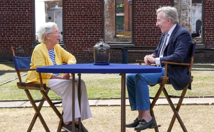 Leigh Keno (right) appraises a Davis Pennington brown stoneware face jug, ca. 1917, in Savannah, Ga. ANTIQUES ROADSHOW “Georgia State Railroad Museum, Hour 2” premieres Monday, February 2 at 8/7C PM on PBS.