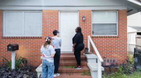 Volunteers with Florida Rising, a progressive nonprofit that organizes residents to take political action on state and local issues, knock on doors in Jacksonville, Fla., to encourage residents to vote no on an amendment that would cut property taxes.