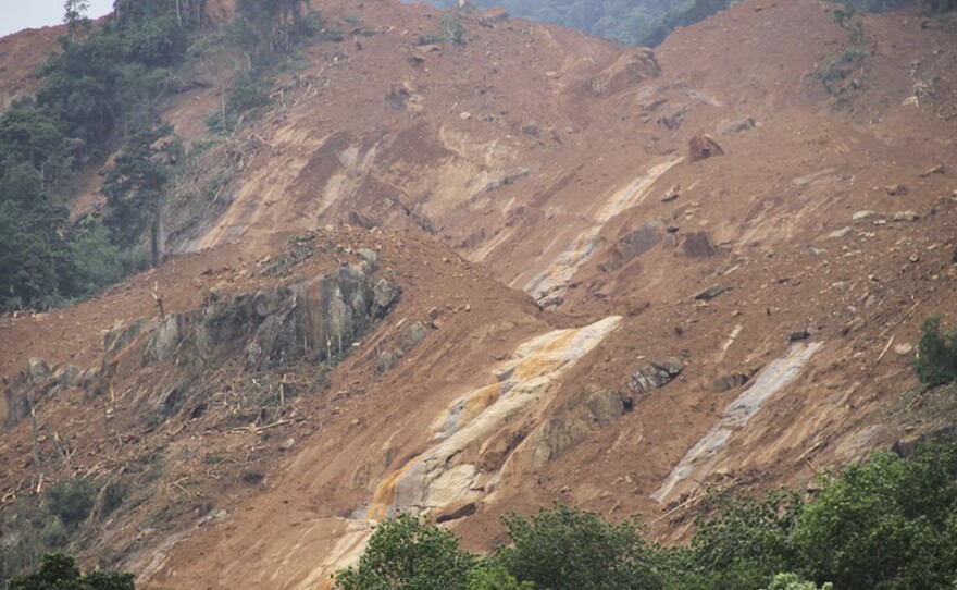 This photograph provided by the Sri Lanka Red Cross Society shows the aftermath of a landslide at Aranayake in Kegalle District. The Red Cross said more than 200 families are missing.