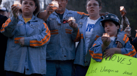 Mourners hold a candlelight vigil April 10 for the miners who died April 5 in Massey Energy's Upper Big Branch coal mine in Montcoal, W.Va.