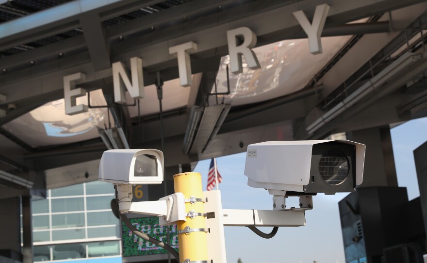 U.S. Customs and Border Protection security cameras scan license plates as motor vehicles cross the U.S.-Mexico border from Tijuana, Mexico, in September 2016 in San Ysidro, Calif.