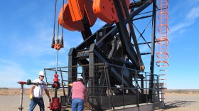 Like countries throughout the Americas, Argentina is feverishly drilling for oil and gas. Workers are shown here at a derrick in the desert in southern Argentina.