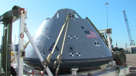 The test model of the capsule for the Orion spacecraft is tethered to a lift, Nov. 3, 2016. 