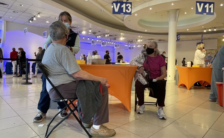 A man receives a COVID-19 vaccine at the Grossmont Center vaccination super station in La Mesa, Feb. 2, 2021.