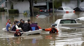 Rescue crews take out residents from a flooded neighborhood in San Jose, Calif., Feb. 21, 2017. 