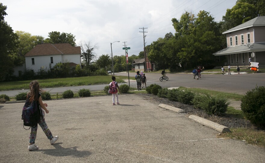 Kids walk home from school in Springfield. The city's population has fallen over the years. Now many young people go to college and leave the city.