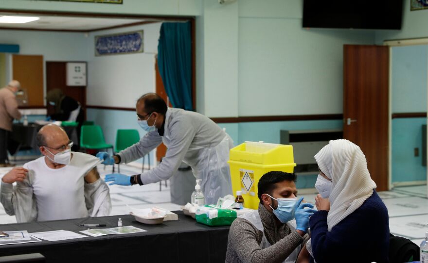 People receive the AstraZeneca COVID-19 vaccine at the Al-Abbas Islamic Center, converted into a vaccination clinic in Birmingham, England, in January. Sheikh Nuru Mohammed, the imam at the mosque, recognized many of his congregants were hesitant to get the "jab," as it's called, due to false rumors and distrust of government. So he began to fight disinformation during his sermons.
