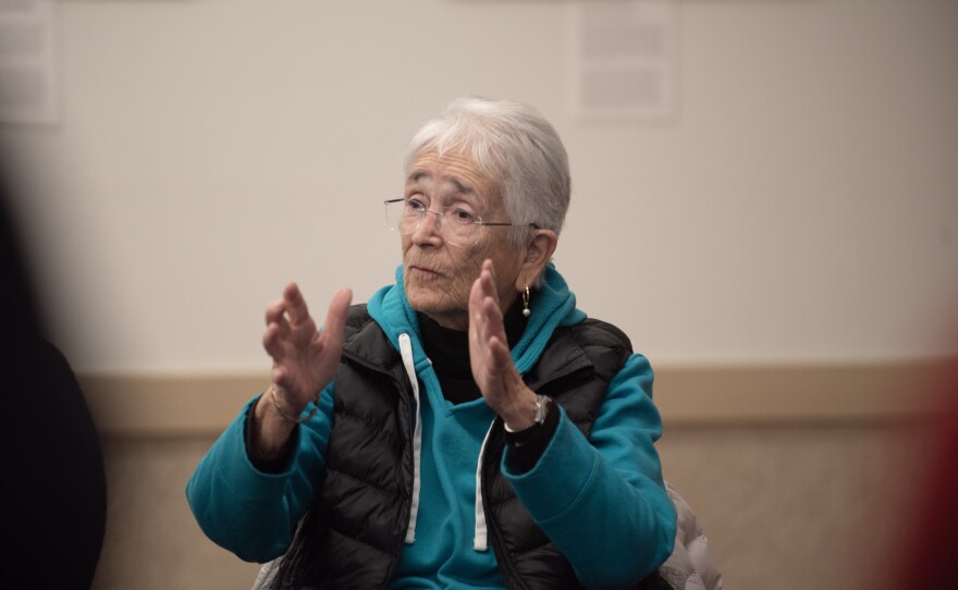 <sup>Alice De La Torre discusses with other South Bay community leaders at the San Ysidro library on Tuesday, Feb. 20, 2024.</sup>