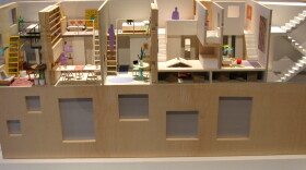 This housing model, showcased at the Museum of the City of New York, depicts possible space-saving methods in the city. Some housing experts say New York's zoning code has discouraged the building of affordable housing by requiring that all apartments be at least 400 square feet. The city is interested in finding ways to rewrite the rules.