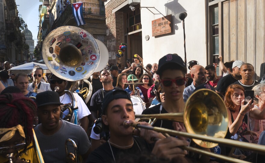 Members of The Soul Rebels, Tank and the Bangas and Trombone Shorty play music through the streets of Old Havana.