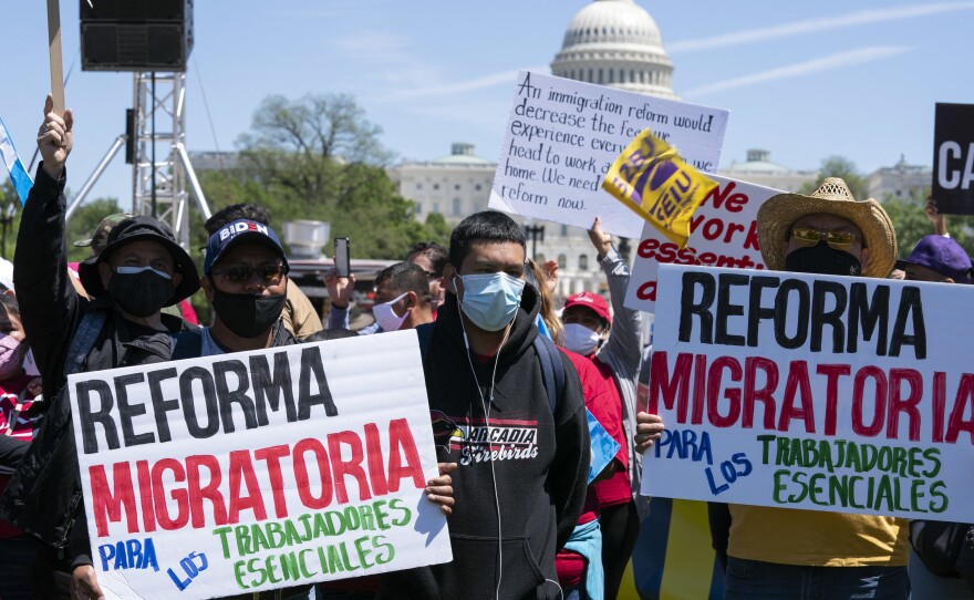 Immigration rights supporters rally Saturday on the National Mall in Washington, D.C., demanding citizenship for essential workers.