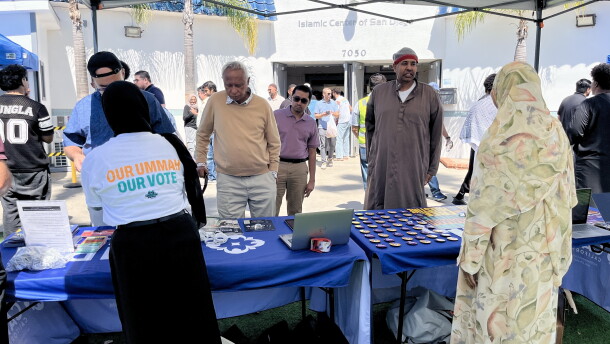 People gather at voter registration tables outside of Islamic Center of San Diego, Sept. 18, 2026.