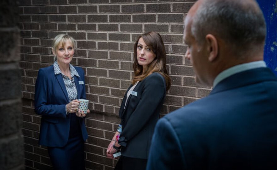 Janet Scott (Lesley Sharp) and Rachel Bailey (Suranne Jones) stand outside the police station.
