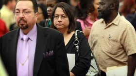 People attend a job fair April 22 in Davie, Fla. The unemployment rate rose to 9.9 percent in April, mainly because 805,000 job-seekers resumed their searches for work.