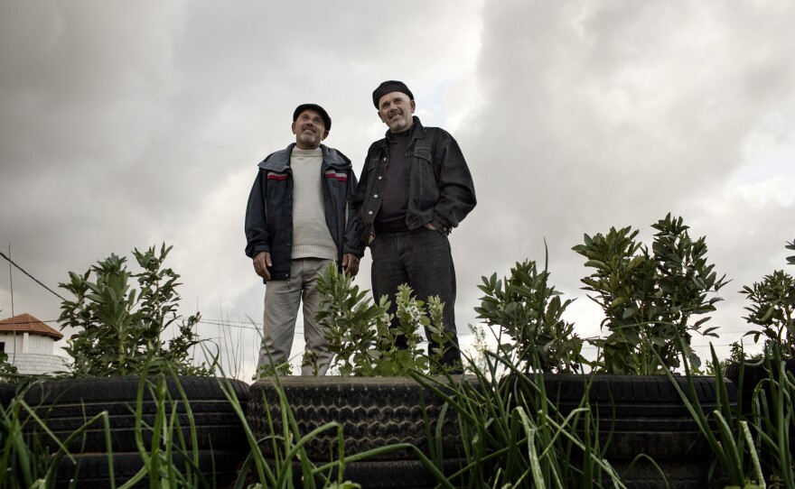 Murad al-Khuffash (right) and his twin brother Hazem are Palestinian farmers living in Marda. Al-Khuffash remembers when settlers took charge of Ariel in the 1970's.